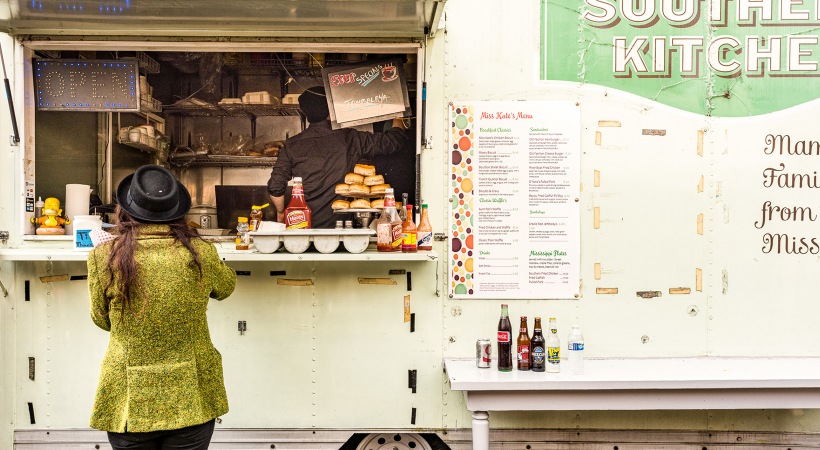 Food Truck  Woman ordering food at a modern food truck