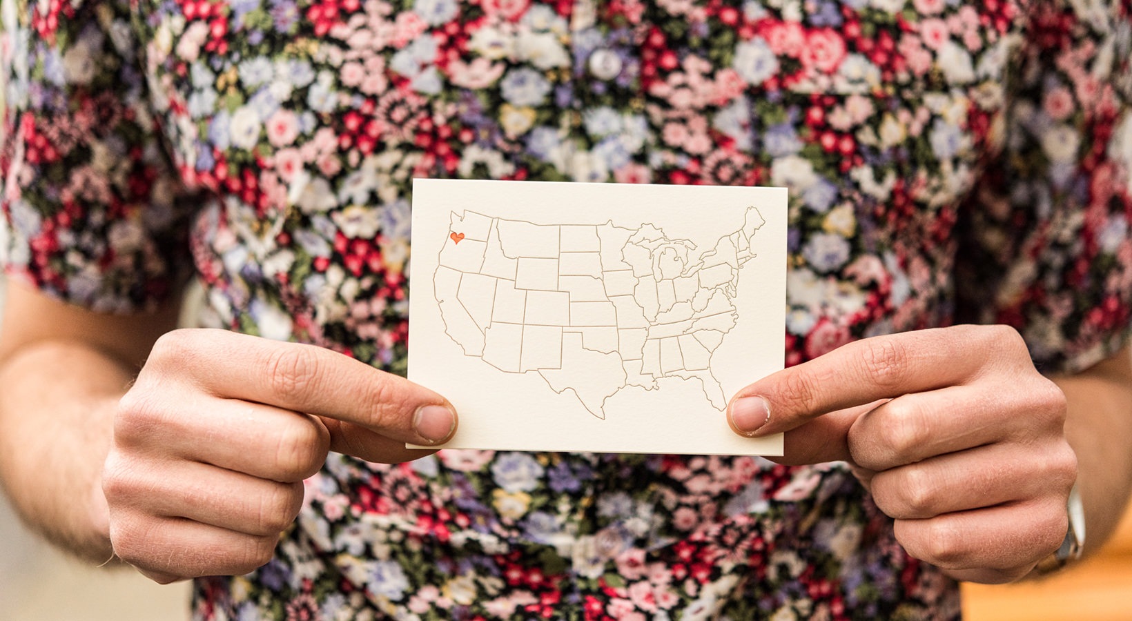 Lifestyle at Peloton Close up of a person holding a picture of the unites states
